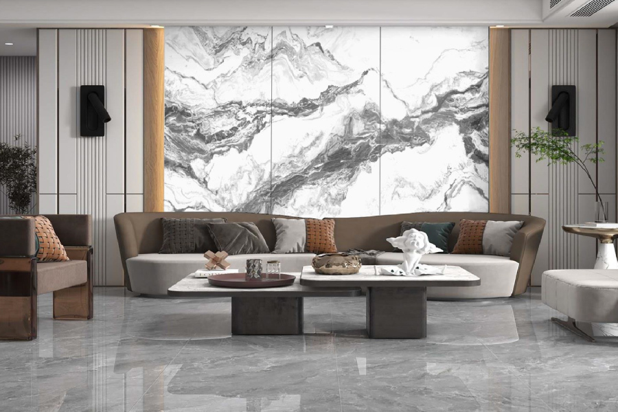 Living room with a bookmatched Balena feature wall behind the sofa
