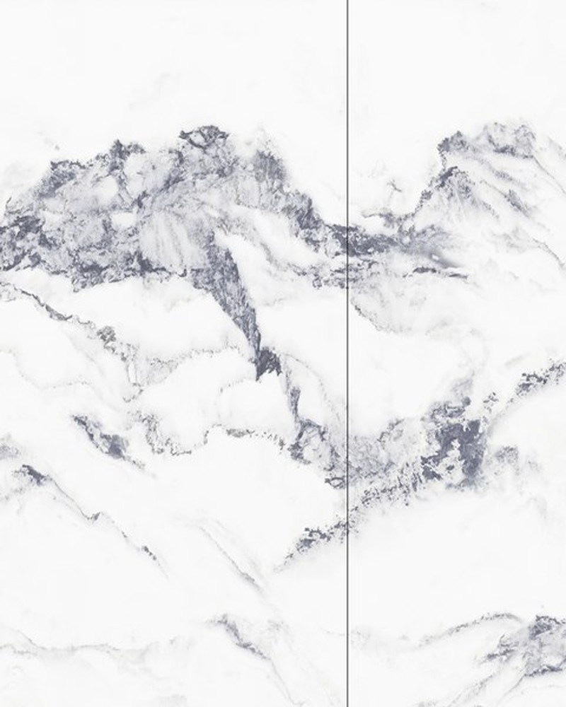 Bookmatched Balena feature wall panel, its veining reading as an ink landscape across the joints