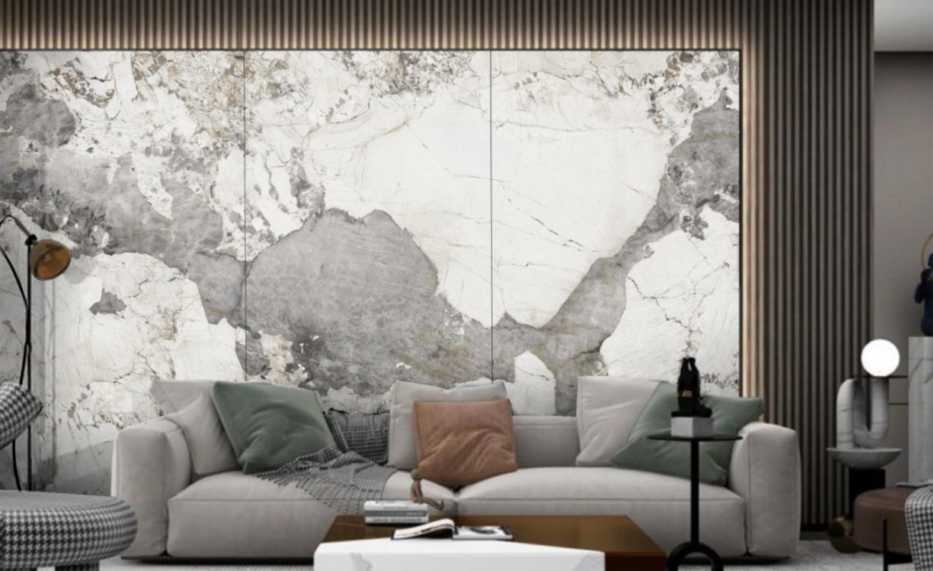 Living room with a full-height Balena marble-look feature wall behind a pale sofa