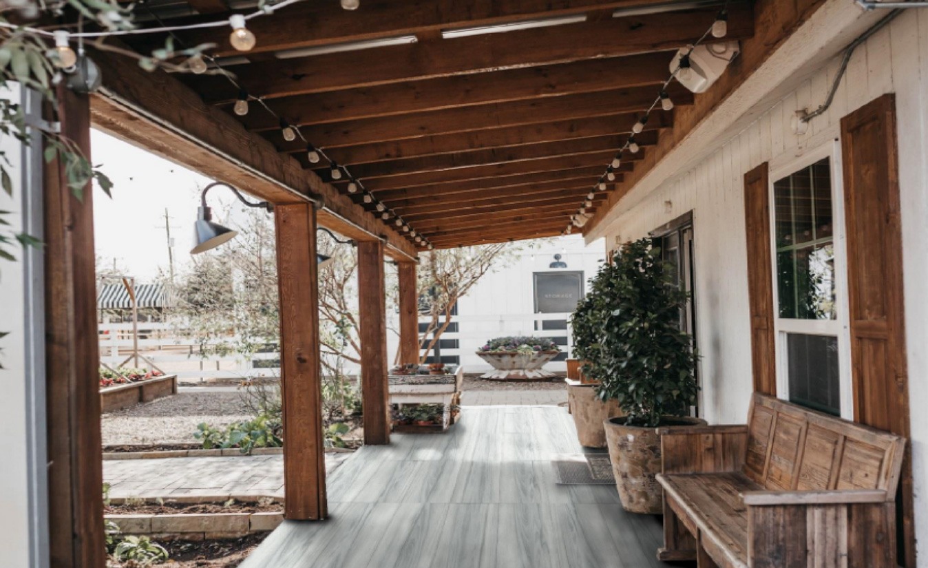 Covered outdoor walkway with wood-look tiled flooring